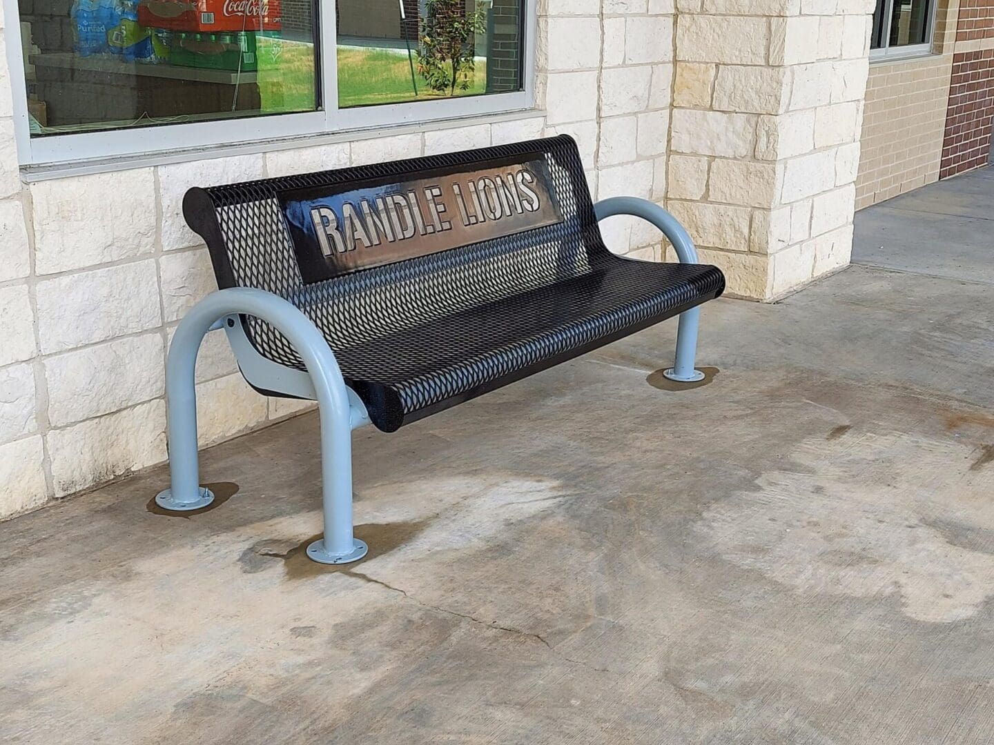 A bench that is sitting on the sidewalk.