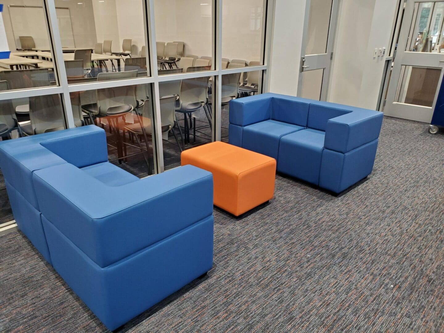A room with blue and orange furniture in it