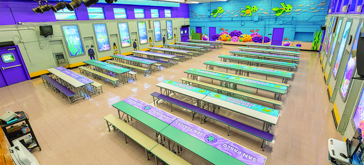A large room with many tables and benches