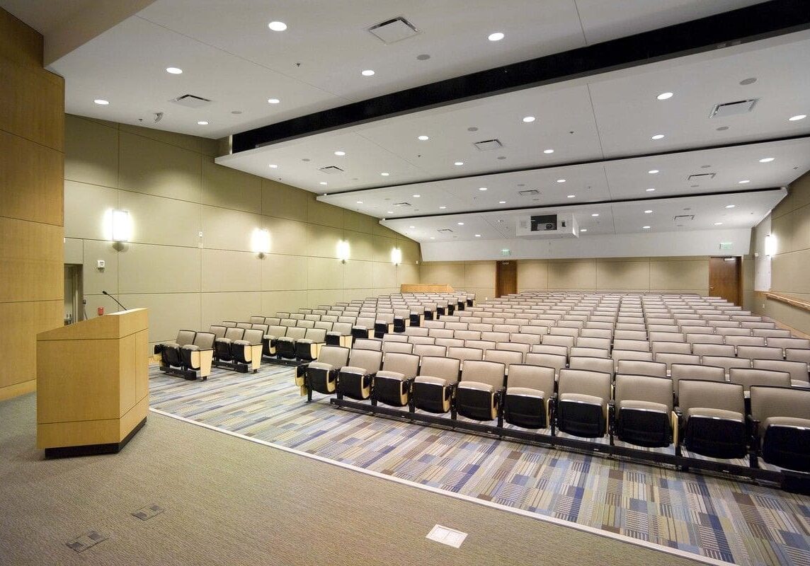 A large room with many chairs and tables